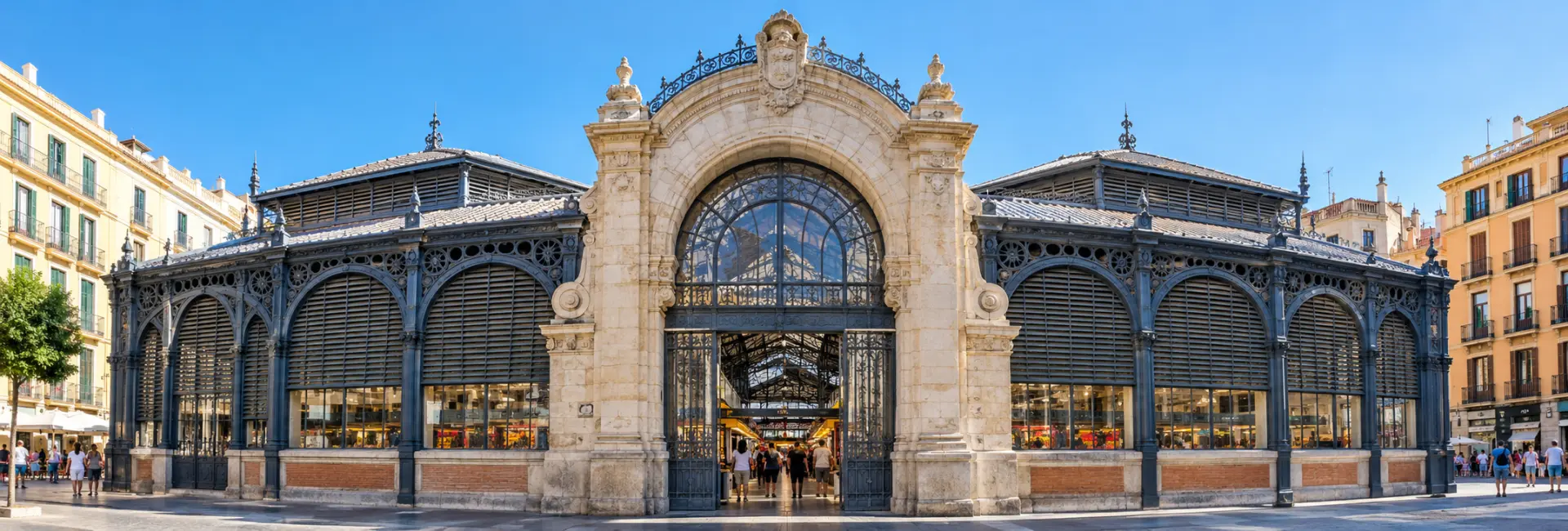 Atarazanas Market in Málaga with a stone entrance and decorative iron facade.