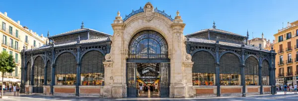 Atarazanas Market in Málaga with a stone entrance and decorative iron facade.
