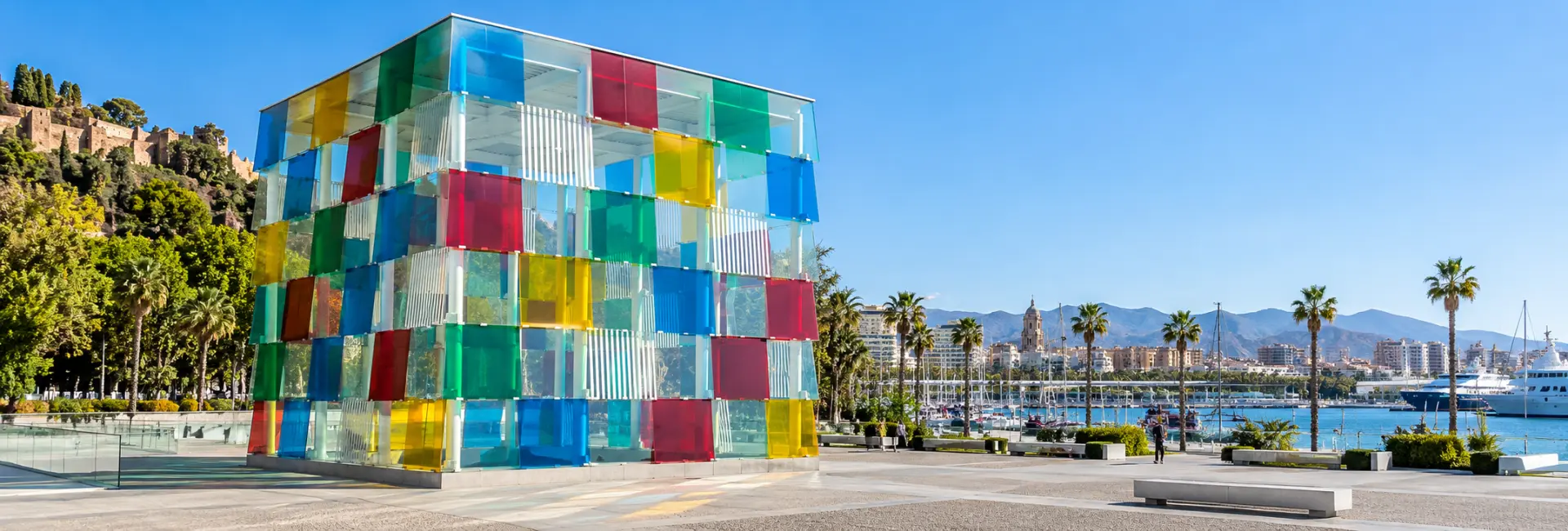 Centre Pompidou Málaga with its colorful glass cube beside the waterfront.