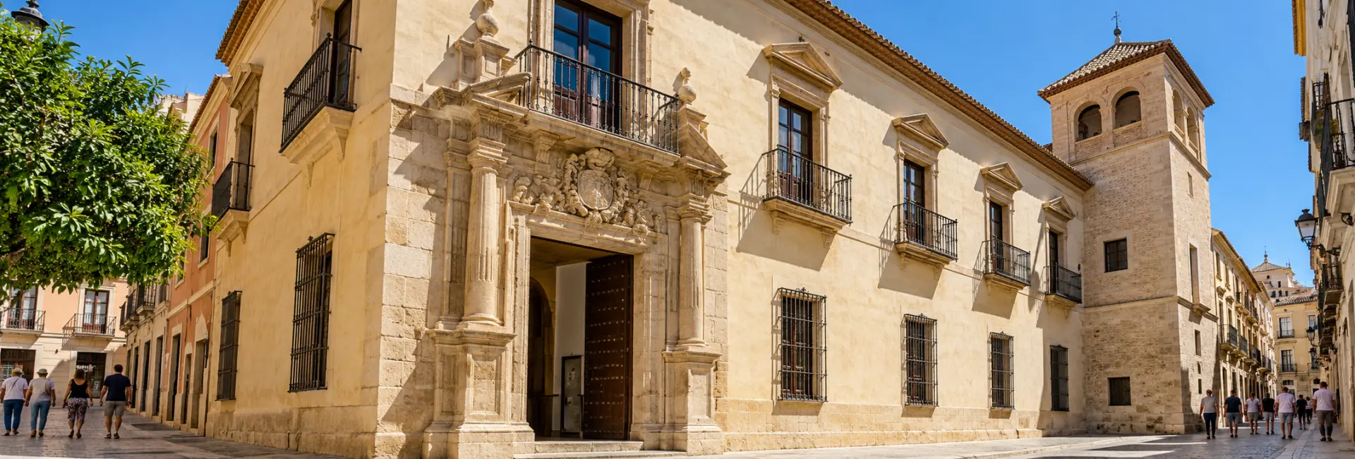 Picasso Museum Málaga exterior with a carved stone entrance and traditional balconies.