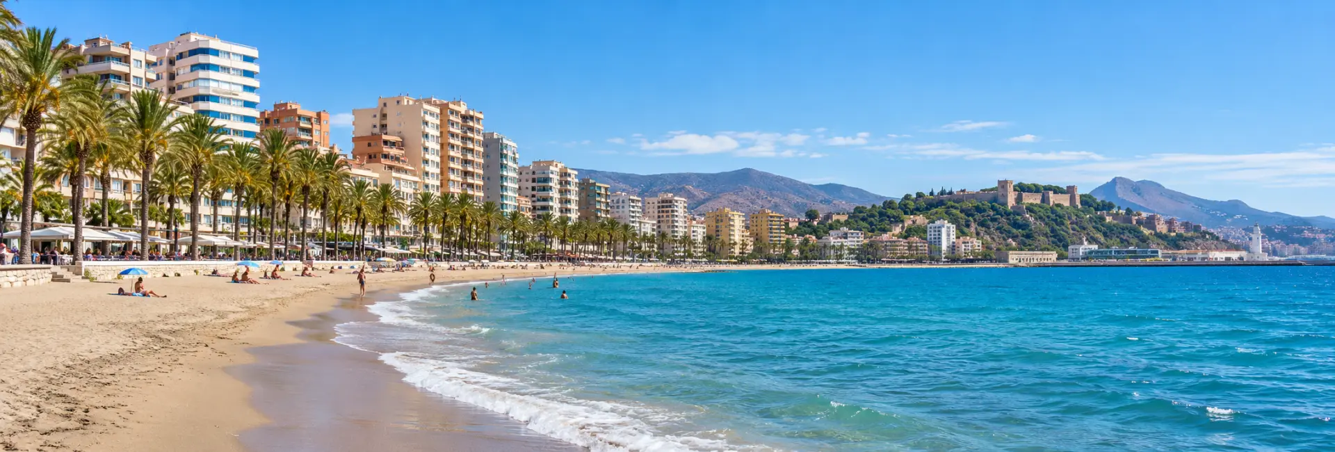 Playa de la Malagueta with sandy shores, blue sea and palm-lined beachfront buildings.