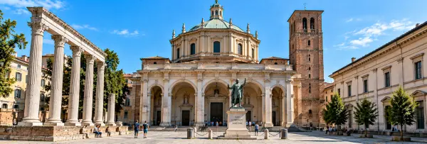 Basilica of San Lorenzo Maggiore in Milan with its grand façade, historic columns, dome and bell tower.
