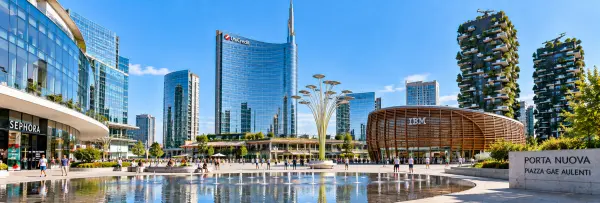 Porta Nuova and Piazza Gae Aulenti in Milan with modern skyscrapers, fountains and Bosco Verticale towers.
