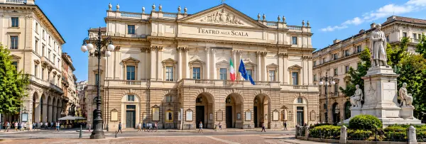 Teatro alla Scala in Milan with its grand neoclassical façade and lively Piazza della Scala.