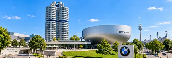 BMW Museum in Munich, Germany, with its iconic silver bowl-shaped building and BMW headquarters