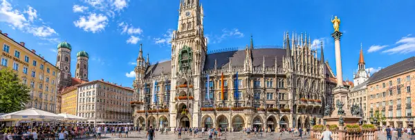 Marienplatz in Munich, Germany, with the ornate Neues Rathaus and Frauenkirche towers