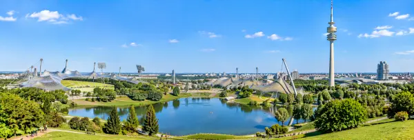 Olympiapark in Munich, Germany, with the Olympic Stadium, lake, and Olympiaturm