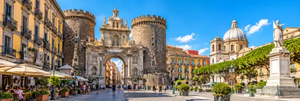 Historic gateway and lively square in Naples Historic Centre, Italy