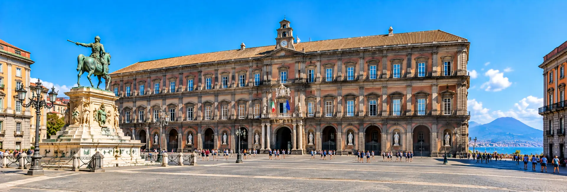 Royal Palace of Naples with its grand historic façade and equestrian statue