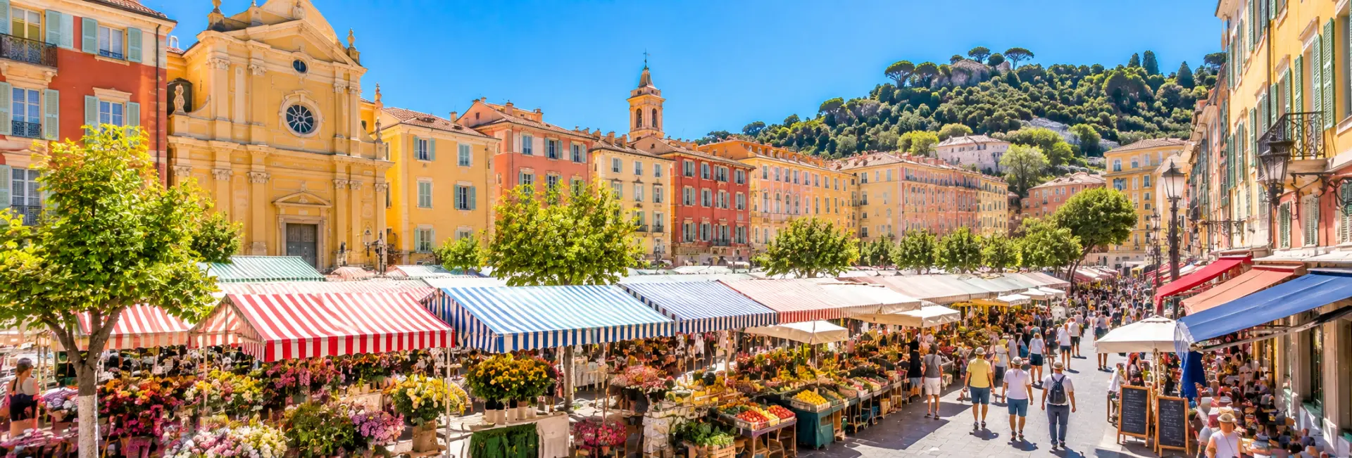 Cours Saleya Market in Nice, France, with colorful stalls and historic pastel buildings