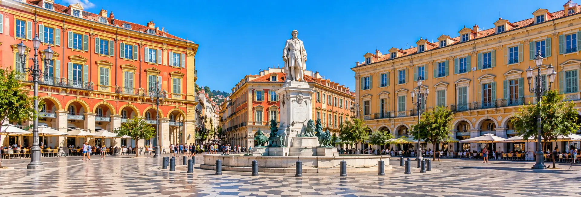 Place Garibaldi in Nice, France, with its colorful arcaded buildings and central statue.