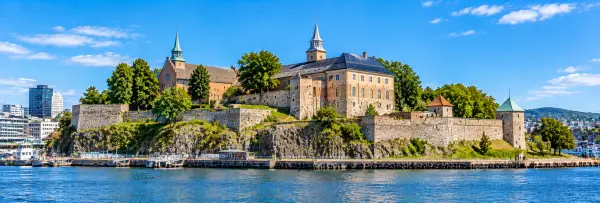 Akershus Fortress in Oslo, Norway, overlooking the harbor with its historic stone walls and towers.