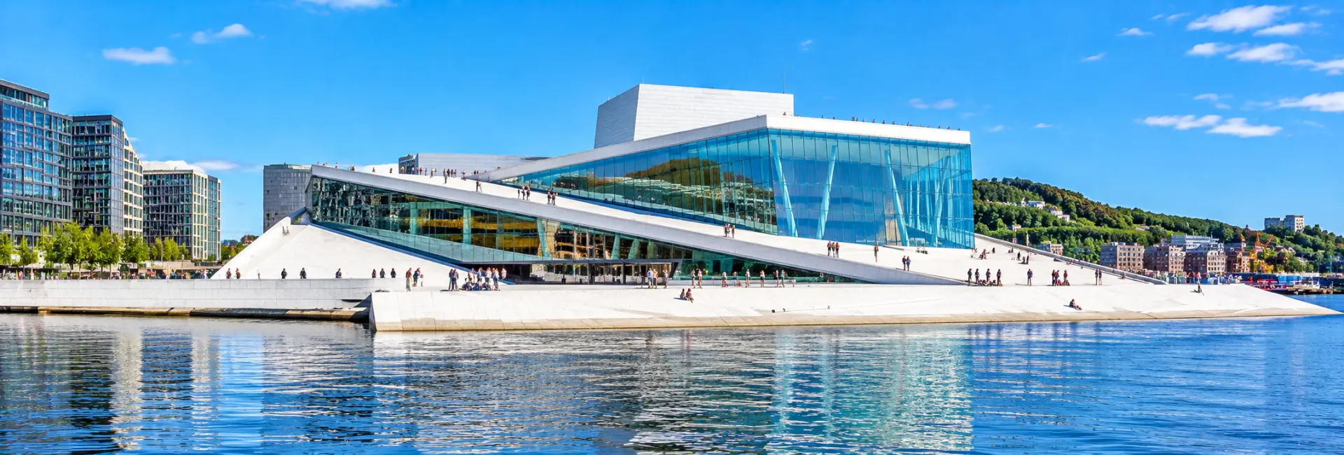 Oslo Opera House in Oslo, Norway, with its white marble roof overlooking the waterfront.