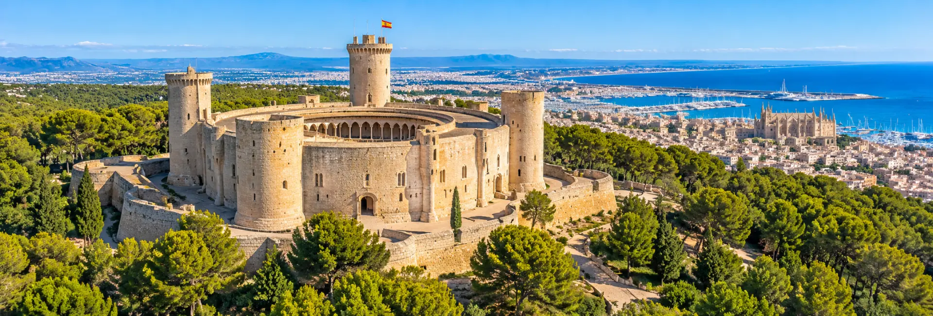Panoramic view of Bellver Castle, a circular Gothic fortress overlooking Palma de Mallorca, Spain.