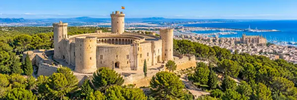 Panoramic view of Bellver Castle, a circular Gothic fortress overlooking Palma de Mallorca, Spain.