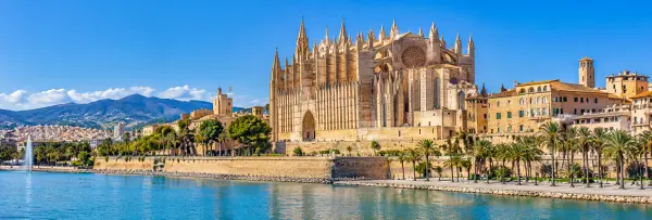 Panoramic view of Palma Cathedral (La Seu) overlooking the waterfront in Palma de Mallorca, Spain.