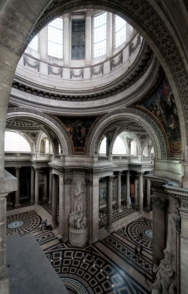 Interior view of the Panthéon showing grand arches, columns and geometric marble floors