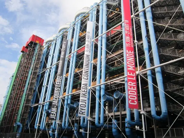 Close-up of the Centre Pompidou's glass escalator tubes and exposed framework