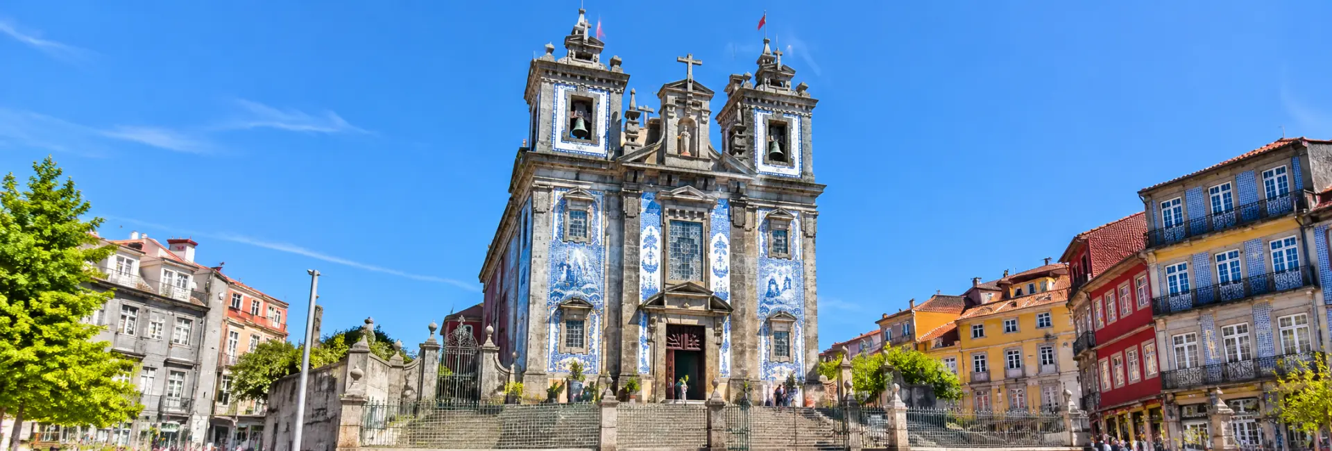 Church of Saint Ildefonso in Porto, Portugal, featuring its ornate blue-and-white tiled façade.