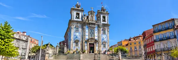 Church of Saint Ildefonso in Porto, Portugal, featuring its ornate blue-and-white tiled façade.