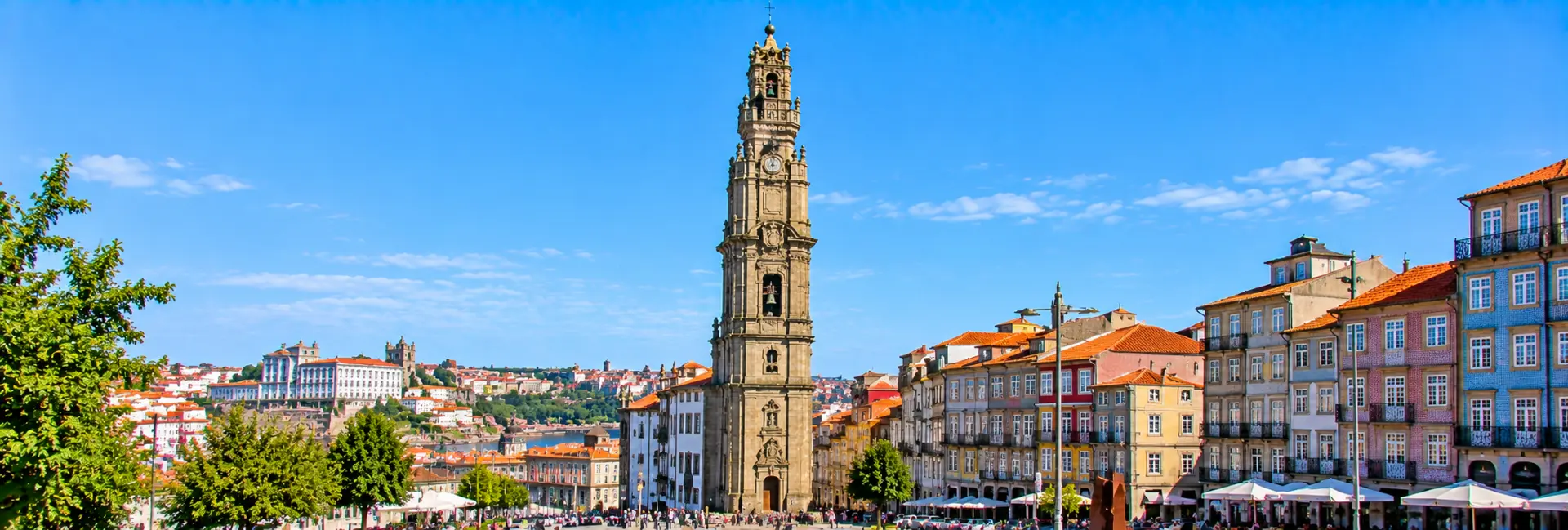Clérigos Tower in Porto, Portugal, featuring its historic Baroque architecture and surrounding colorful buildings.