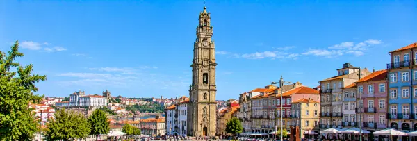 Clérigos Tower in Porto, Portugal, featuring its historic Baroque architecture and surrounding colorful buildings.
