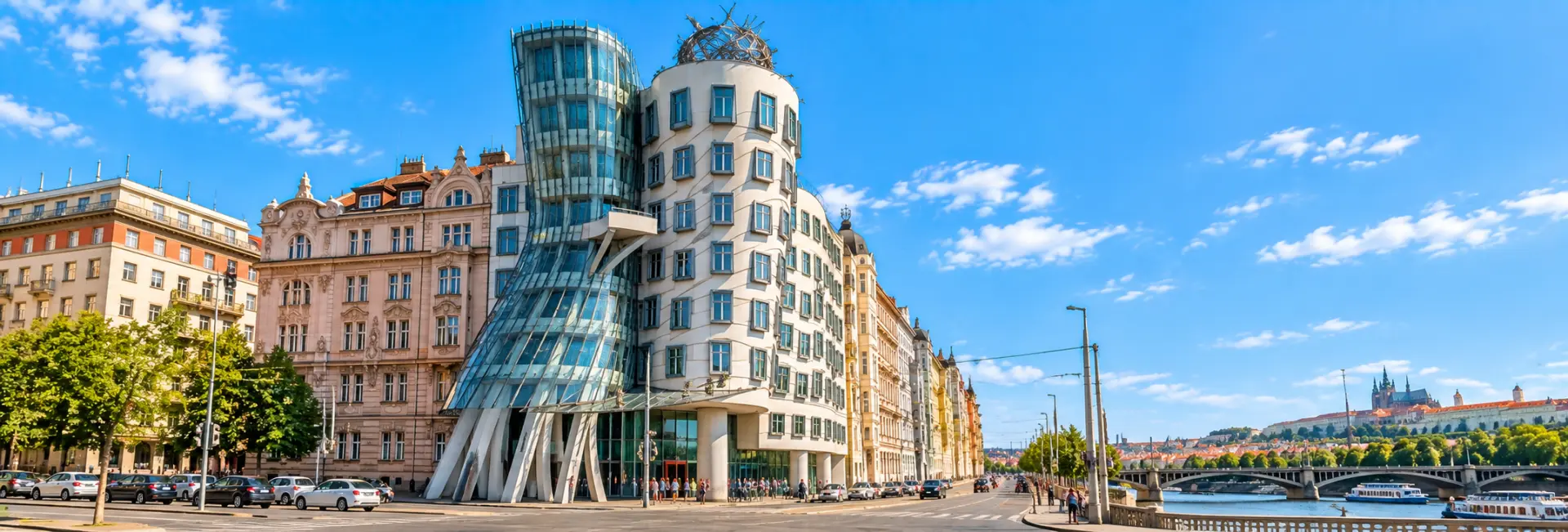Dancing House in Prague with its distinctive curved glass tower beside the Vltava River