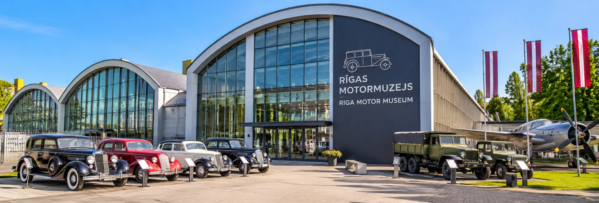 Riga Motor Museum in Latvia, featuring modern architecture and a collection of classic cars and vintage vehicles.