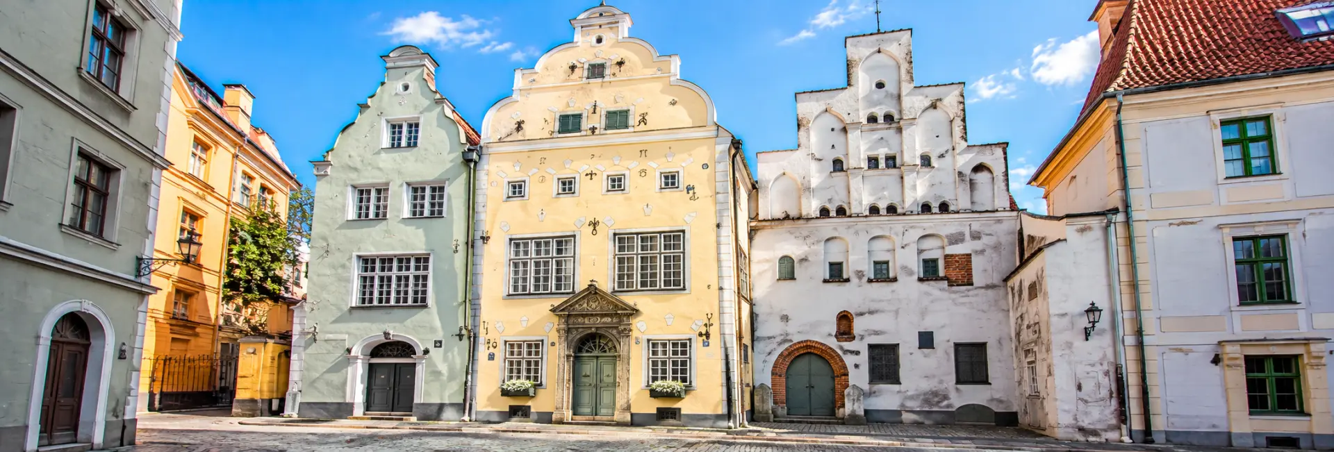 The Three Brothers in Riga, Latvia, featuring three historic houses with distinctive medieval architecture and façades.