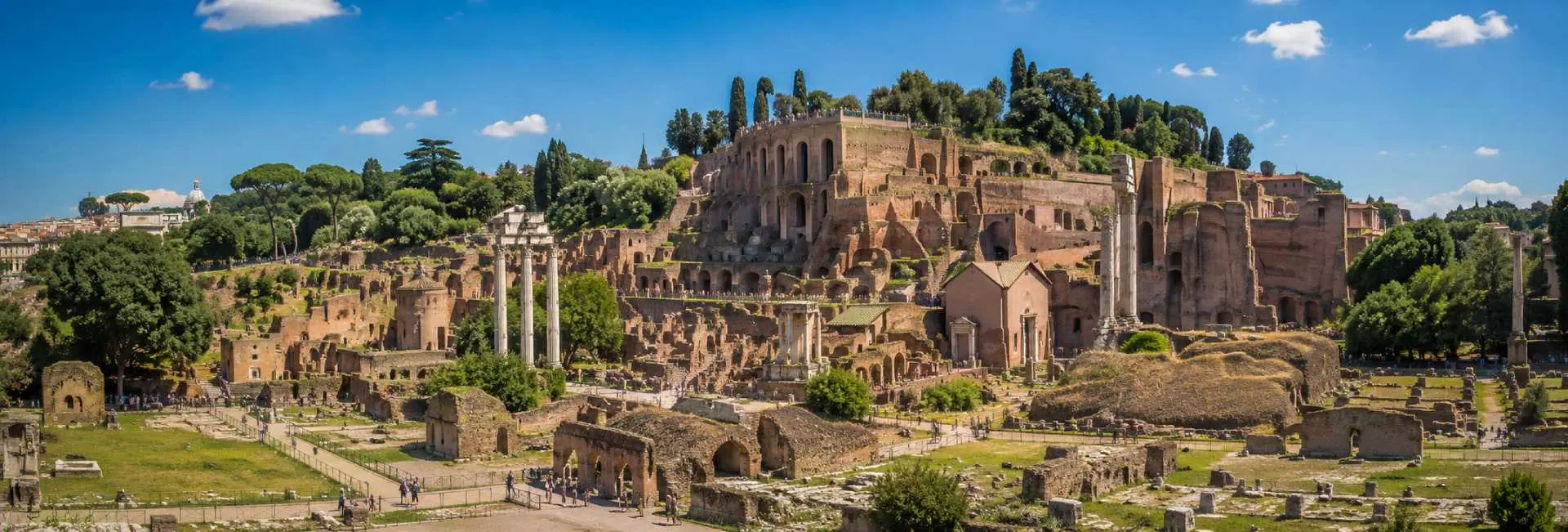 Palatine Hill in Rome with ancient Roman ruins, columns, arches, and Mediterranean greenery