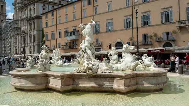Fountain of Neptune with detailed marble sculptures in Piazza Navona, Rome
