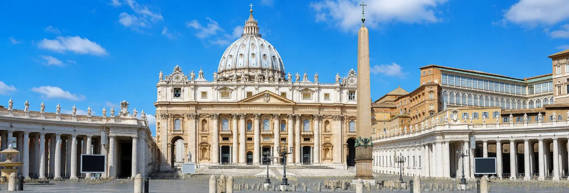 St. Peter's Basilica in Vatican City viewed from St. Peter's Square on a bright clear day