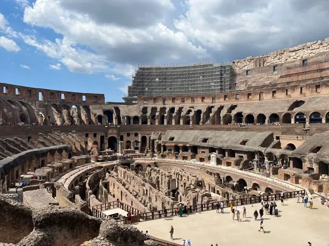 Interior of the Colosseum in Rome, Italy, showing the ancient arena, underground chambers, and historic seating.