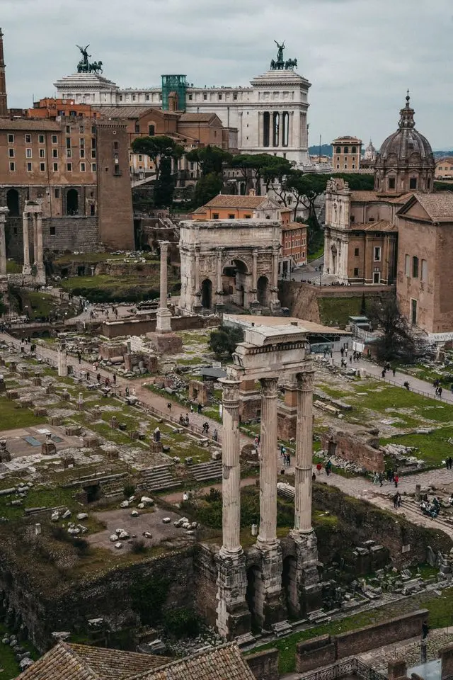 Aerial view of Roman Forum ruins with Arch of Septimius Severus
