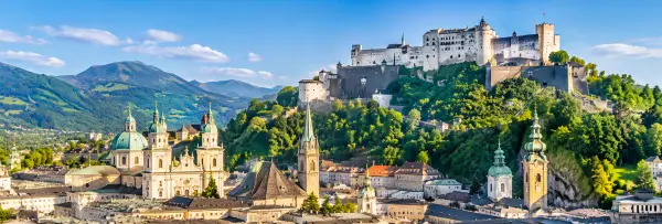 Hohensalzburg Fortress overlooking Salzburg’s historic cityscape and surrounding Austrian Alps.