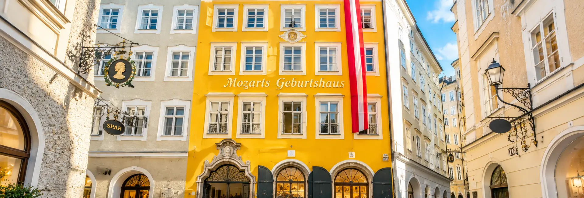 Mozart’s Birthplace with its distinctive yellow facade in Salzburg Old Town, Austria.