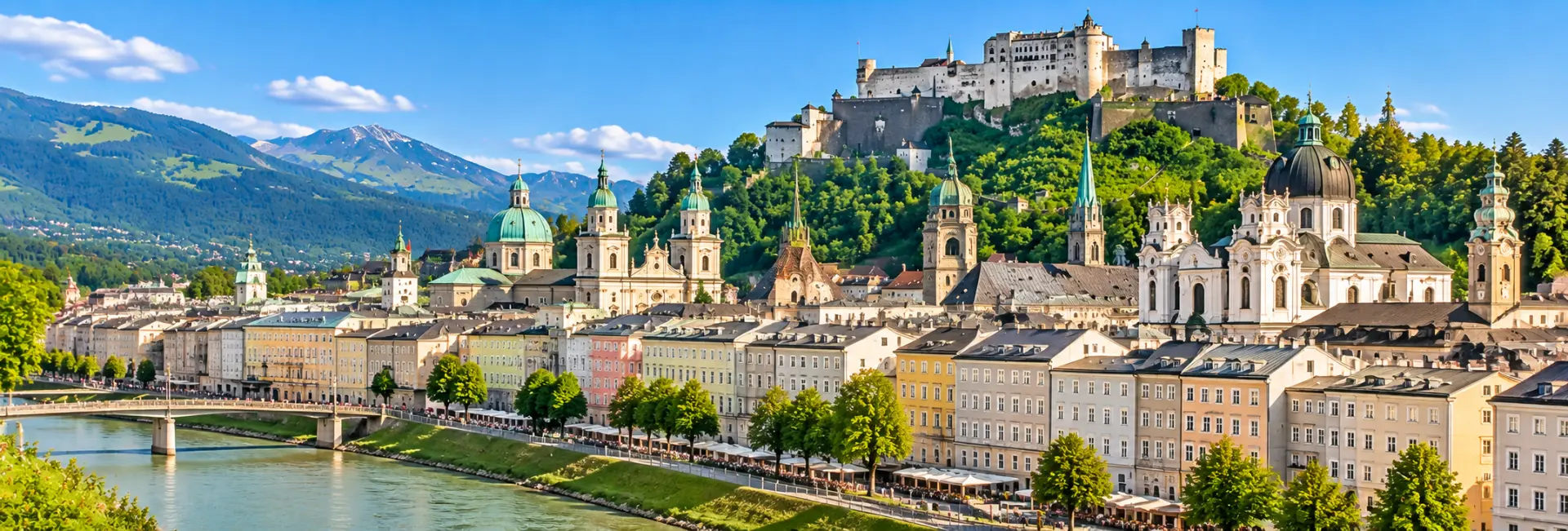 Salzburg Old Town with historic buildings, Salzach River and Hohensalzburg Fortress in Austria.