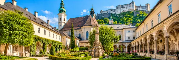 St. Peter’s Abbey in Salzburg with its historic church, courtyard and Hohensalzburg Fortress above.