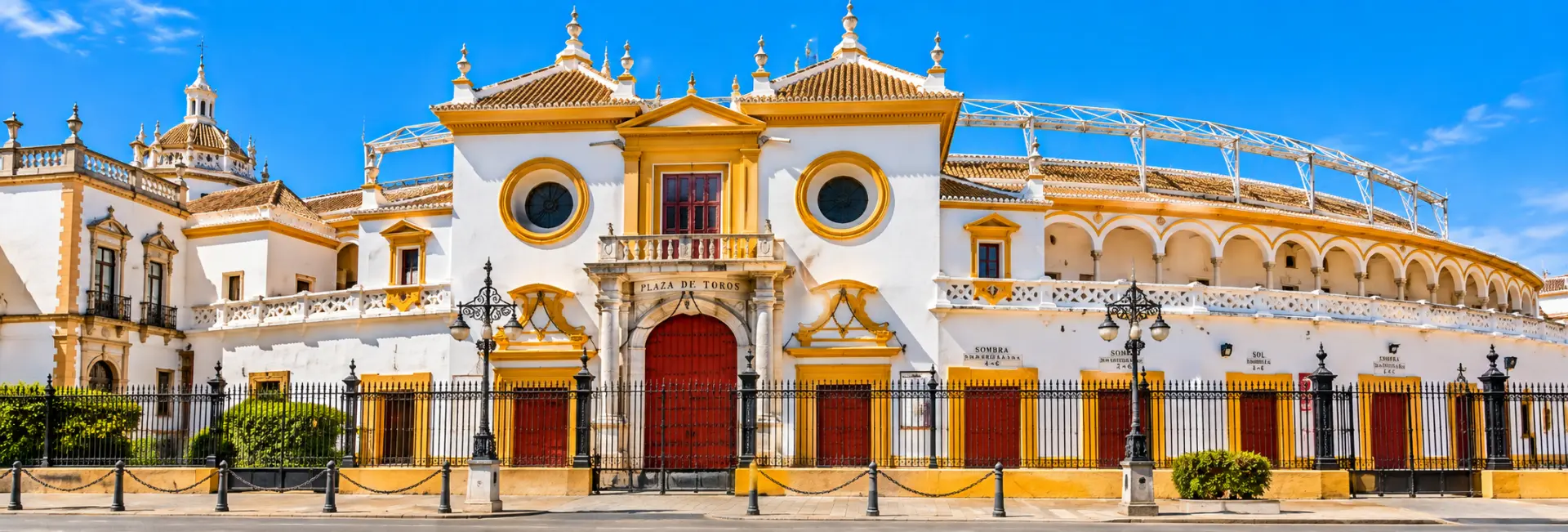 Plaza de Toros de la Maestranza in Seville, Spain, featuring its historic white-and-ochre bullring façade.