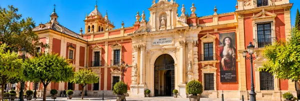Seville Museum of Fine Arts in Spain, featuring an ornate Baroque façade and historic entrance.