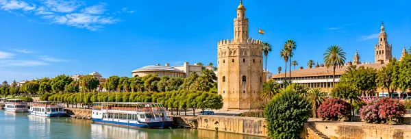 Torre del Oro in Seville, Spain, overlooking the Guadalquivir River.