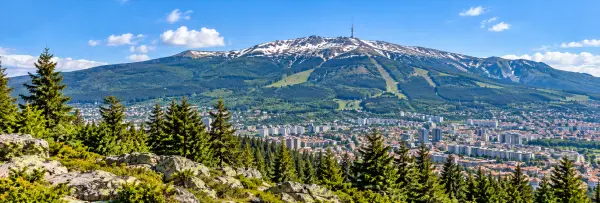 Panoramic view of Vitosha Mountain near Sofia, Bulgaria, featuring forested slopes, rocky peaks and scenic landscapes.