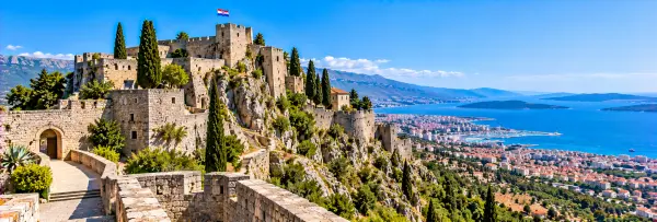 Klis Fortress near Split, Croatia, perched on a rocky ridge with panoramic views of the Adriatic coast.