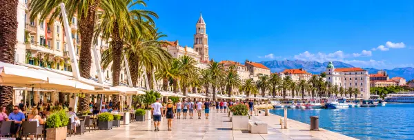 Riva Promenade in Split, Croatia, lined with palm trees, cafés and historic buildings along the Adriatic