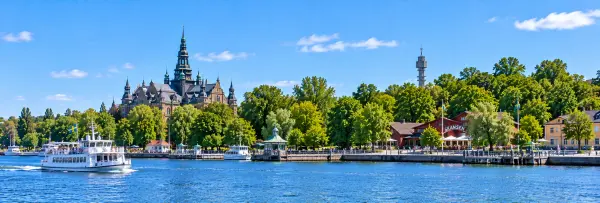 Djurgården Island waterfront with historic museums and greenery in Stockholm, Sweden