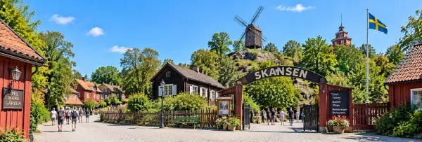 Skansen Open-Air Museum with historic Swedish buildings and windmill in Stockholm, Sweden