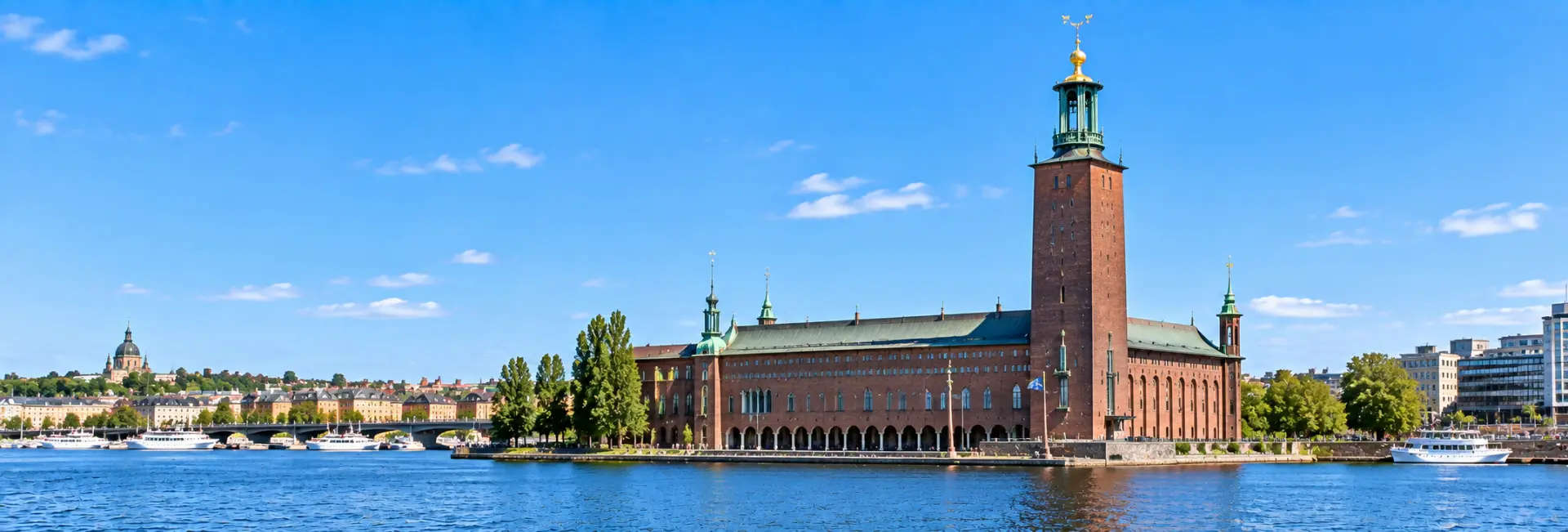 Stockholm City Hall with its red-brick façade and iconic tower overlooking the waterfront in Sweden