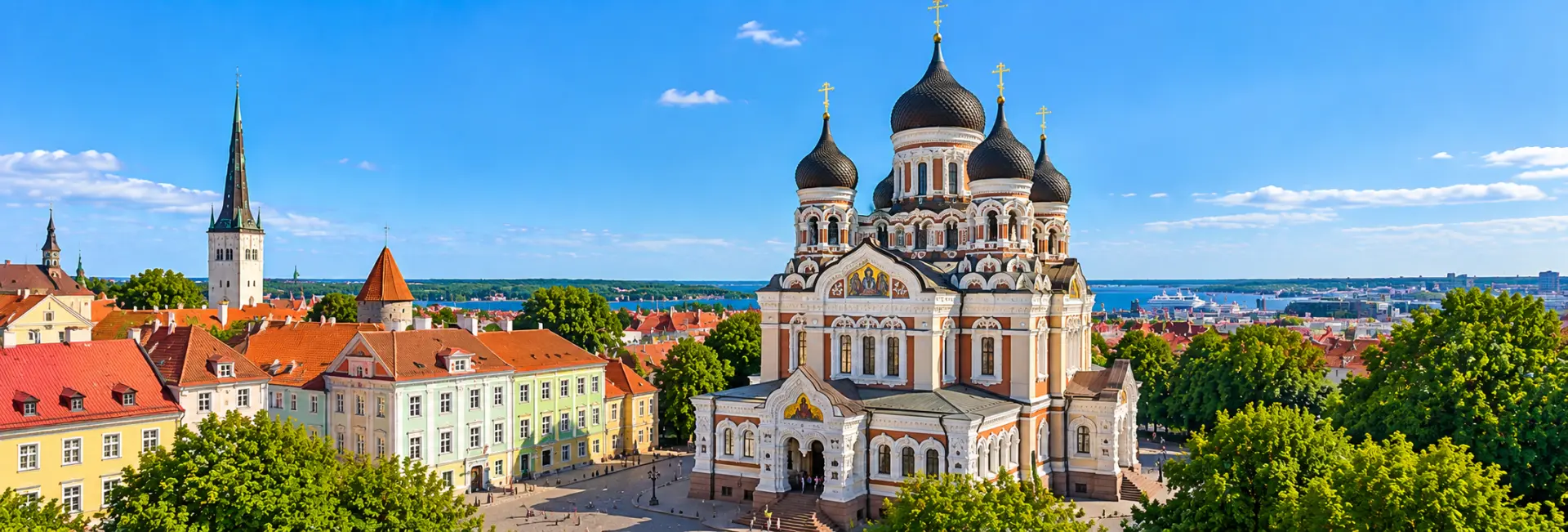 Alexander Nevsky Cathedral in Tallinn, Estonia, featuring ornate architecture, black onion domes and golden crosses.