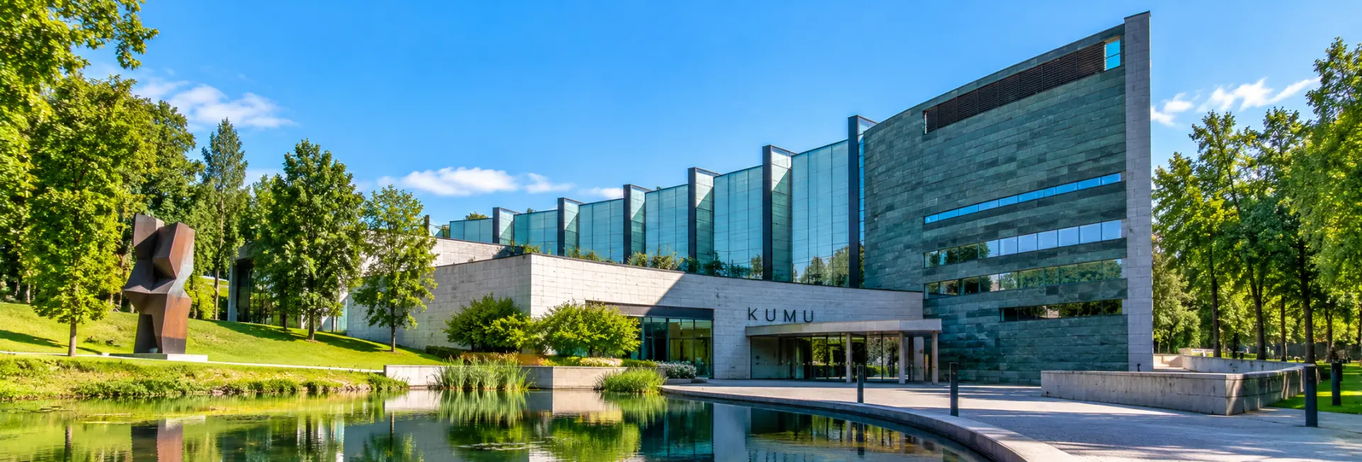 Kumu Art Museum in Tallinn, Estonia, featuring modern architecture, glass façades and landscaped surroundings.