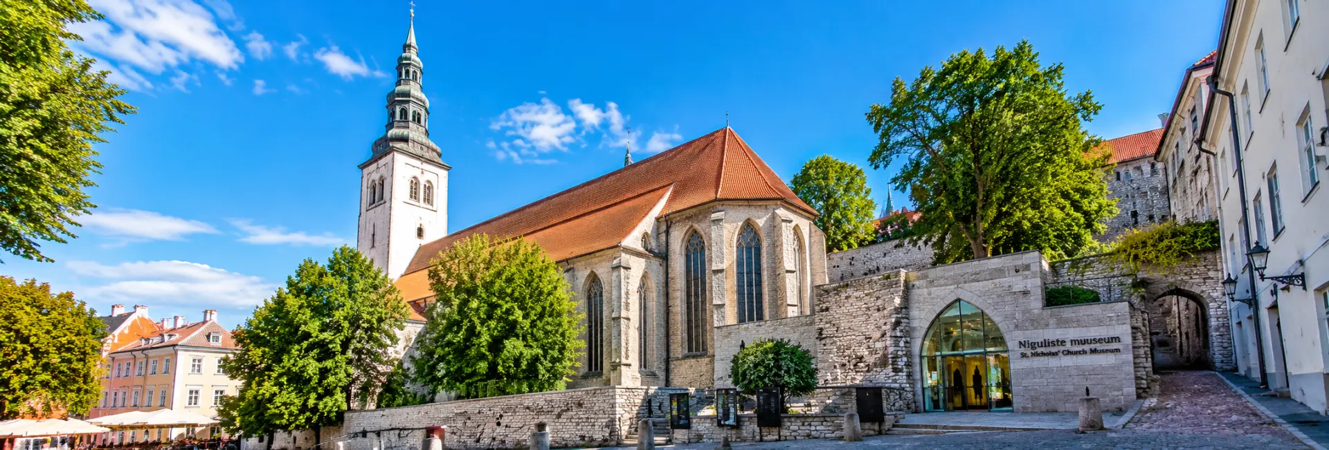 St. Nicholas’ Church and Museum in Tallinn, featuring Gothic architecture, a historic tower and medieval stone walls.